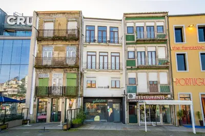 a row of buildings in a city at Riverside Oasis by LovelyStay in Vila Nova de Gaia
