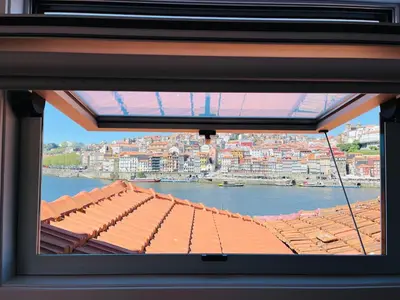 a view from the window of a building with a roof at Douro River Apartments in Vila Nova de Gaia