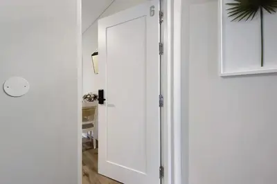 a white door in a room with a hallway at Porto Bello - Apartamento - 6 in Porto