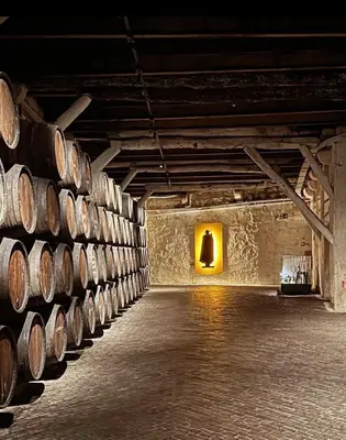 a row of barrels in a wine cellar at Porto Bello - Apartamento - 6 in Porto