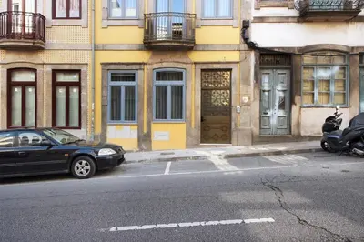 a black car parked on the side of a street at Porto Bello - Apartamento - 8 in Porto