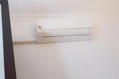a white printer sitting on the corner of a wall at Dellarose Max in Porto