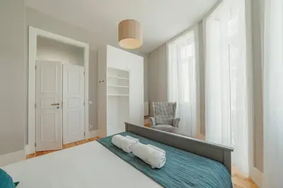 a bedroom with a bed with two pillows on it at Bonfim Premium by Hosty in Porto