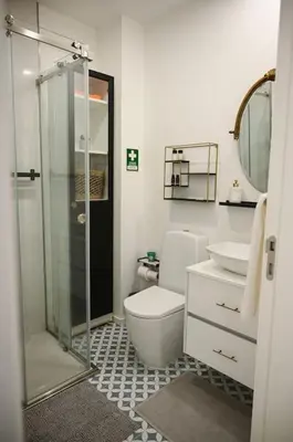 a bathroom with a shower and a toilet and a sink at Douro Premium Garden by MP in Vila Nova de Gaia