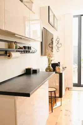 a kitchen with a black counter top in a room at Douro Premium Garden by MP in Vila Nova de Gaia