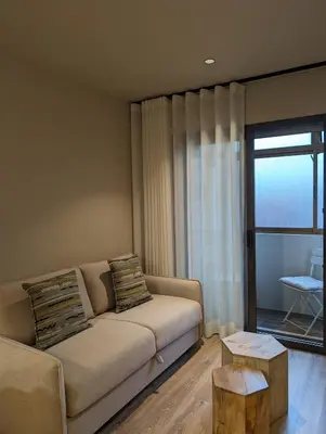 a living room with a couch and a table at BonJardim Apartment by Nove in Porto