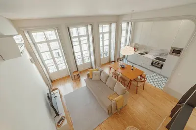 a living room with a couch and a table at Deluxe Duplex by Hosty in Porto