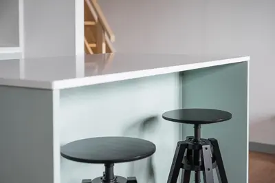 a counter with two stools under a counter top at GuestReady - A brilliant stay near Ribeira in Porto