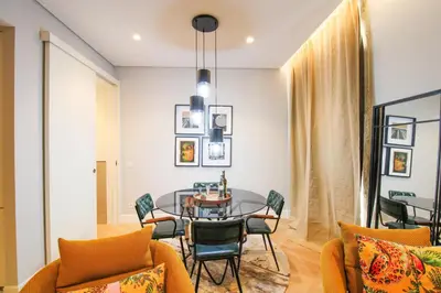 a dining room with a table and chairs at Saudade do Porto in Porto