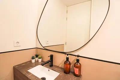 a bathroom with a sink and a mirror at Saudade do Porto in Porto