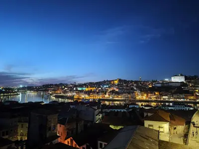 a view of a city at night at Fervença Apartments in Vila Nova de Gaia