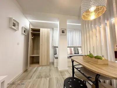 a living room with a dining table and a bedroom at ROSARIO 1Ds by rosario inn porto in Porto