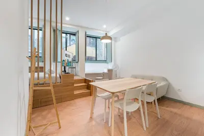a kitchen and dining room with a table and chairs at GuestReady - A modern stay in Downtown in Porto