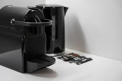 a black blender sitting on top of a counter at GuestReady - A modern stay in Downtown in Porto