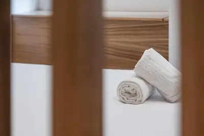 a roll of toilet paper sitting on a bed at GuestReady - A modern stay in Downtown in Porto