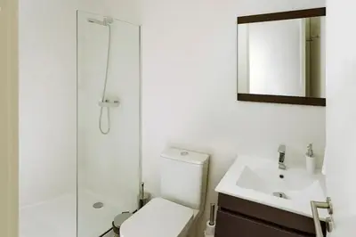 a bathroom with a toilet and a sink and a shower at Fernandes Tomas Rooftop in Porto