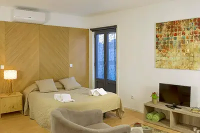 a bedroom with a bed with two towels on it at Fernandes Tomas Rooftop in Porto