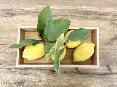a wooden box with a bunch of yellow pears at ROSARIO 1Dn by rosario inn porto in Porto