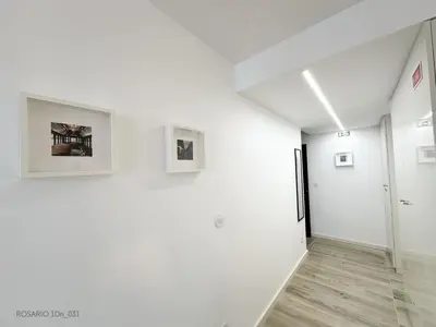 a room with white walls and pictures on the wall at ROSARIO 1Dn by rosario inn porto in Porto