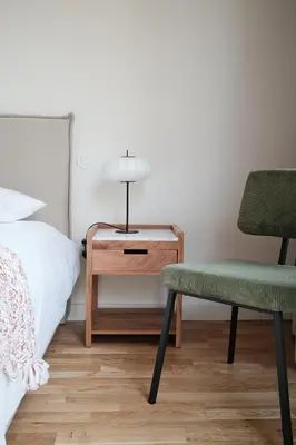 a bedroom with a bed and a table and a chair at Corujeira Apartments by MyALPlace in Porto