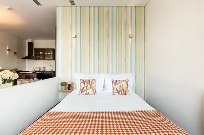 a bedroom with a bed with two pillows at YOUROPO - Torre in Porto