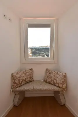 a bench in a room with a window at Miradouro 25 - Porto centre - luxury epic views in Porto