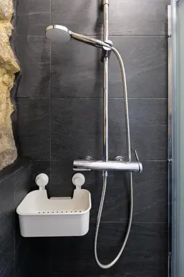 a bathroom with a shower with a sink at Charming Studio with Garden in Porto in Porto