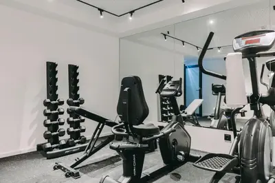 a gym with cardio equipment in a room at Hotels 705 Porto Prime Home in Porto