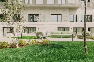 a building with a couch in a yard at Hotels 705 Porto Prime Home in Porto