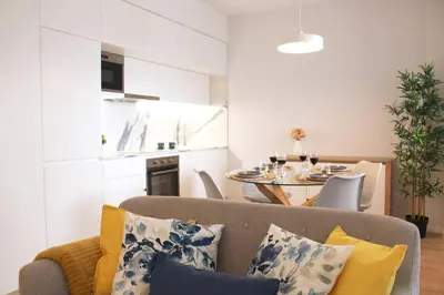 a living room with a couch and a table at Marquês City Center Flat in Porto