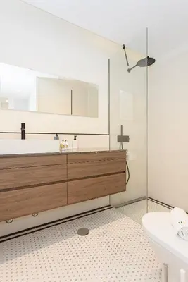 a bathroom with a tub and a sink and a mirror at Liiiving in Porto - Luxury Design Apartments in Porto