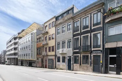 a row of buildings on the side of a street at Host Wise - Santa Catarina Cosy Downtown in Porto