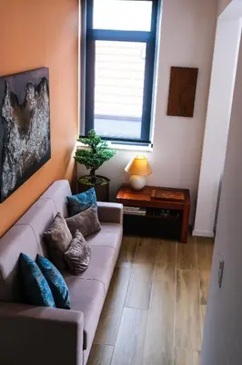 a living room with a couch and a window at Casas da Corujeira 2 in Porto