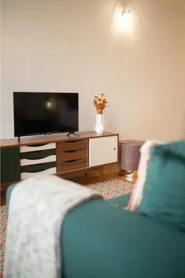 a living room with a tv and a couch at NEW - Bright Studio in Santa Catarina in Porto