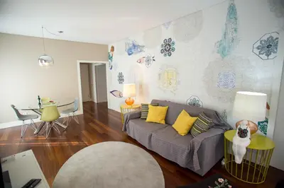 a living room with a couch and a table at Cardosas Story Apartments by Porto City Hosts in Porto
