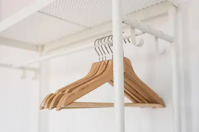 a group of wooden hangers in a room at PortoNest Downtown Studios in Porto