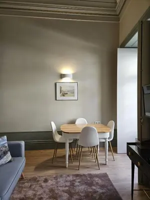 a dining room with a table and chairs at São João Boutique Apartment in Porto