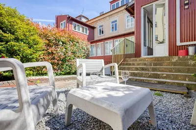 a table and chairs sitting on a patio with stairs at OPORTO GUEST Luxus Ildefonso in Porto
