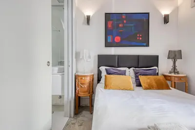 a bedroom with a bed and two night stands at OPORTO GUEST Luxus Ildefonso in Porto