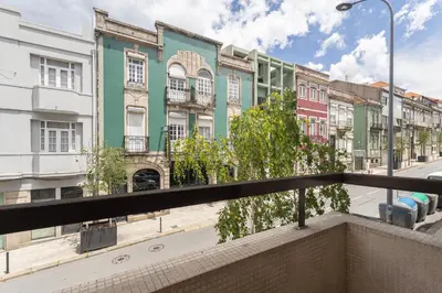 a row of colorful buildings on a city street at Porto Cozy Space in Porto