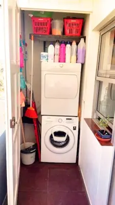 a washer and dryer in a tiny house at DockApartment in Vila Nova de Gaia