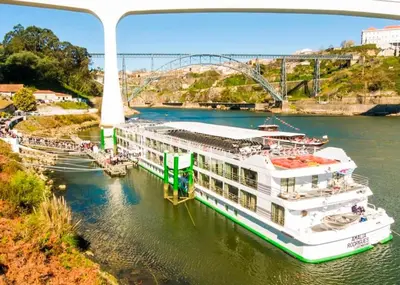 a bridge over a river with a brick road at DockApartment in Vila Nova de Gaia