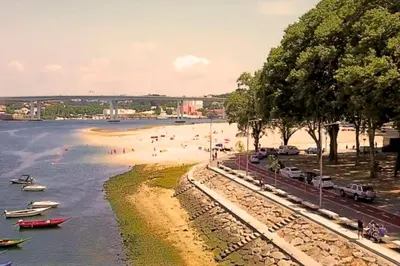 a group of people on a beach near the water at DockApartment in Vila Nova de Gaia