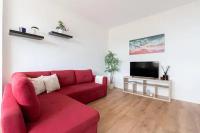 a kitchen with white cabinets and a sink at Host Wise - Comfy Minimalist Flat in Porto