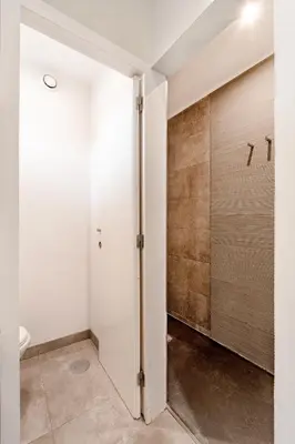 a bathroom with white walls and a sliding door at VIVA Peaceful Zen Retreat in Porto