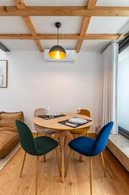 a dining room with a table and chairs at Urban Loft in Porto