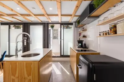 a kitchen with a sink and a refrigerator at Urban Loft in Porto