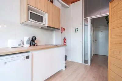 a kitchen with a counter top and a microwave at Marquês Studio by Amber Star Rent in Porto