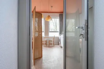 a hallway with a door leading to a dining room at Marquês Studio by Amber Star Rent in Porto