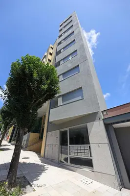 a tall building with a tree in front of it at FLH Boavista Woody Duplexes in Porto